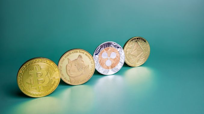 Bitcoin, Ripple XRP, Dogecoin, Ethereum cryptocurrency on green background